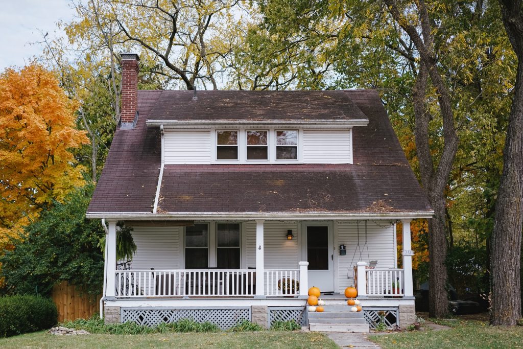 white two story house during fall